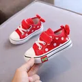 Red polka dot children's canvas shoes with cute bow detail and soft soles for girls - Red