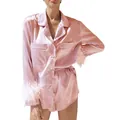 Detailed close-up view of pink satin pajama shirt with feather cuffs and matching shorts - S / Top And Bottom / Pink