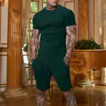 Athletic men's dark green short sleeve T-shirt and shorts set worn by muscular model - M / Top And Bottom / Grass Green