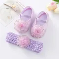 Close-up detail of purple baby princess shoes with matching crochet flower headband set - Purple With Gold Trim Flower and Headband / Size 11 (Inner Length 10.5cm)