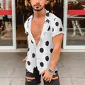 Close-up of men's white short-sleeve shirt with bold black polka dots on a male model - S / Tops / White
