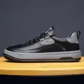 Premium Herren-Sneaker aus schwarzem Leder, Low-Top mit einer stilvollen grauen Kontrastsohle - Schwarz