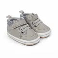 Close-up of grey faux leather infant pre-walker shoes with Velcro strap and soft sole - 11cm / Gray