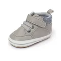 Close-up detail of grey pebbled leather infant pre-walker shoe with striped ankle trim - 11cm / Gray