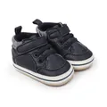 Close-up detail of navy faux leather baby boy pre-walker sneakers with velcro - 11cm / Blue