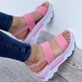 Close-up of pink wedge platform sandals with buckle strap and thick white sole - 35 / Pink