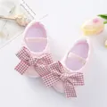 Detailed view of pink baby princess walking shoes featuring a red checkered bow decoration. - Size 11 (Inner Length 10.5CM) / Pink Plaid Style (GZ810) / Pink