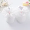 Close-up of white baby princess shoes featuring large decorative white satin bows. - Size 12 (Inner Length 11CM) / White