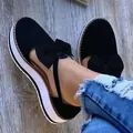 Detailed macro view of black platform sandals with large bow and white thick sole. - 35 / Black