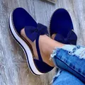 Detail shot of women's blue platform wedge sandals featuring an elegant bow on the strap. - 35 / Blue
