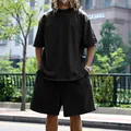 Detailed full view of men's oversized black terry cloth short sleeve and shorts casual set - M / Top And Bottom / Black