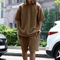 Men's brown loose fit short sleeve t-shirt and shorts set in street outdoor setting - M / Top And Bottom / Brown