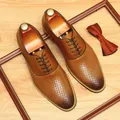Elegant brown cowhide perforated breathable business casual men's shoes on wood - 38 / Brown