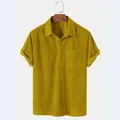 Detail of men's casual mustard yellow corduroy short sleeve shirt with lapel and pocket - Yellow