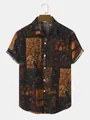 Detailed view showing the intricate vintage ethnic floral pattern on this shirt - S / Tops / Brown