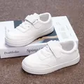 Classic white children's sneakers with velcro straps shown on a stylish magazine - 26 / White