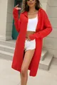 Woman wearing a long red hooded knit cardigan with white crop top and shorts - S / Tops / Red