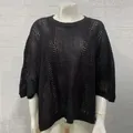 Detail of black crochet mesh knit cover-up with hollow-out pattern for beach vacation - Black