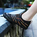Breathable black children's water shoes with vibrant orange stripes and non-slip sole - 35 / Black