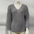 Macro view of the grey V-neck knit sweater showing detailed waffle weave texture - S / Tops / Gray