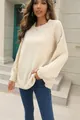 Close-up of cream ribbed knit texture on oversized long-sleeve women's sweater - S / Tops / Off White