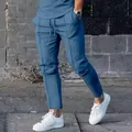 Detailed view of men's blue slim fit casual trousers for urban high street fashion - Denim Blue