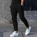 Men's casual black sweatpants featuring adjustable drawstring and stylish vertical seam details - M / Bottoms / Black