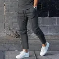 Side view detail of men's slim fit dark grey joggers with front seam design - M / Bottoms / Dark Gray
