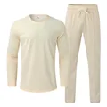 Detailed view of a men's cream-colored long-sleeve T-shirt and matching pants set. - M / Top And Bottom / Apricot