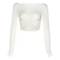 Detailed view of white long-sleeved cropped T-shirt featuring ruched bust and slim fit - S / Tops / Apricot