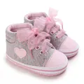 Close-up detail of pink ribbon laces and heart pattern on grey polka dot baby sneakers - Bottom Length 11CM / Gray