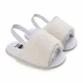Close-up of soft white fluffy baby sandals with elastic backstrap for pre-walkers. - 13cm / White