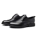 Klassische schwarze Herren-Brogue-Lederschuhe mit eleganten Flügelkappen-Details. - 38 / Britisch Geschnitzt (1607-1) / Schwarz