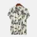 Men's Hawaiian short sleeve shirt with black palm leaf print on cream fabric. - S / Tops / Beige