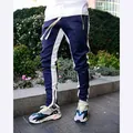 Men's slim-fit track pants with navy and white side stripes and ankle zipper detail - Navy Blue and White