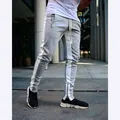 Detail view of gray slim fit men's joggers with white side stripes and ankle zipper accents - M / Bottoms / Grey & White