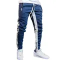 Men's slim fit blue joggers with side white stripes and functional ankle zippers - Blue and White