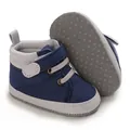 Detail view of navy blue canvas baby walking shoes with soft anti-slip dotted sole - Blue