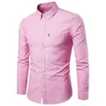 Detail of pink long-sleeve Oxford shirt showing button-down collar and chest pocket - Pink