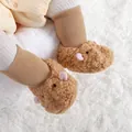 Close-up view of warm plush baby shoes with cute capybara design on white carpet - Insole Length 11cm / 1555 Khaki