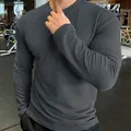 Detailed close-up of men's dark gray long sleeve knit sweater with waffle texture - 3XL / Tops / Iron Grey