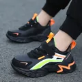 Stylish black kids' running shoes featuring vibrant orange and neon green color accents - 28 / Black