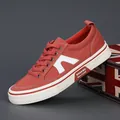 Stylish brick red men's canvas sneakers with white bridge logo and durable white sole. - Brick Red