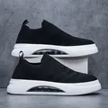 Breathable black fly-knit sock sneakers featuring a stylish white chunky air cushion sole - 39 / Black