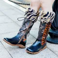 Close-up of stylish printed patchwork tall boots with warm faux fur trim and flat sole - 36 / Dark Blue