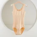 Detailed view of the seamless beige shapewear bodysuit hanging on a classic wooden hanger - XS/S / Set / Nude