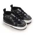 Premium black soft sole baby walker shoes with lace-up detail and sturdy white base - Black