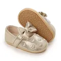 Detail of gold baby girl walker shoes with bow and heart embroidery on rubber sole. - Gold