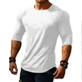 Detail view of men's slim fit long sleeve white T-shirt with round neck athletic design. - S / Tops / White