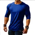Detailed view of royal blue slim fit long sleeve T-shirt for men with muscular build - Blue